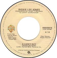 Rickie Lee Jones – A Lucky Guy/Skeletons (7" Vinyl)